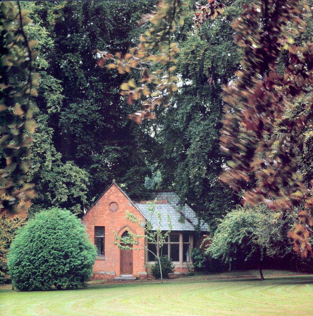 red brick ornamental dairy amongst trees