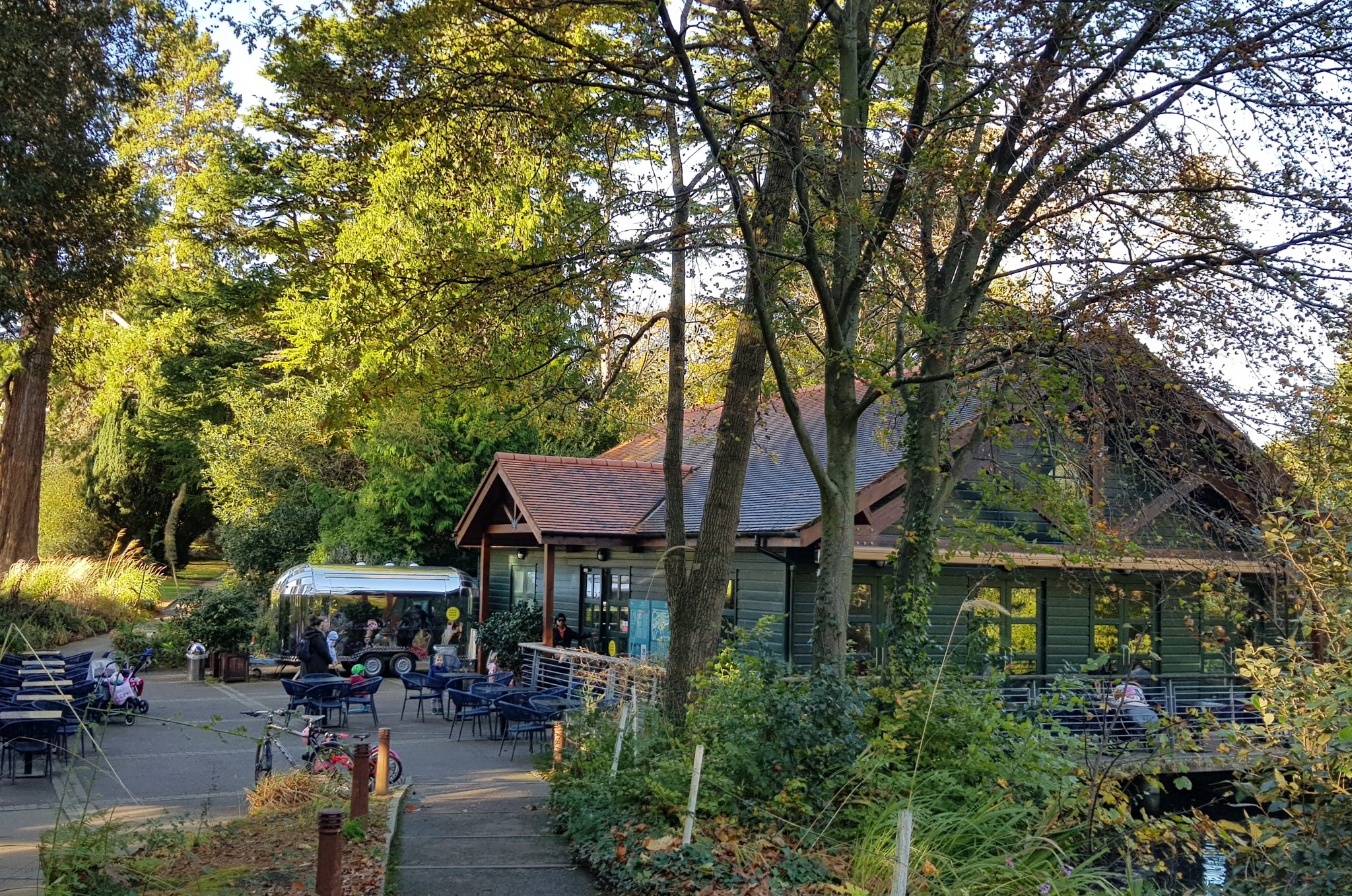 Boathouse 2 café among trees beside Farmleigh lake