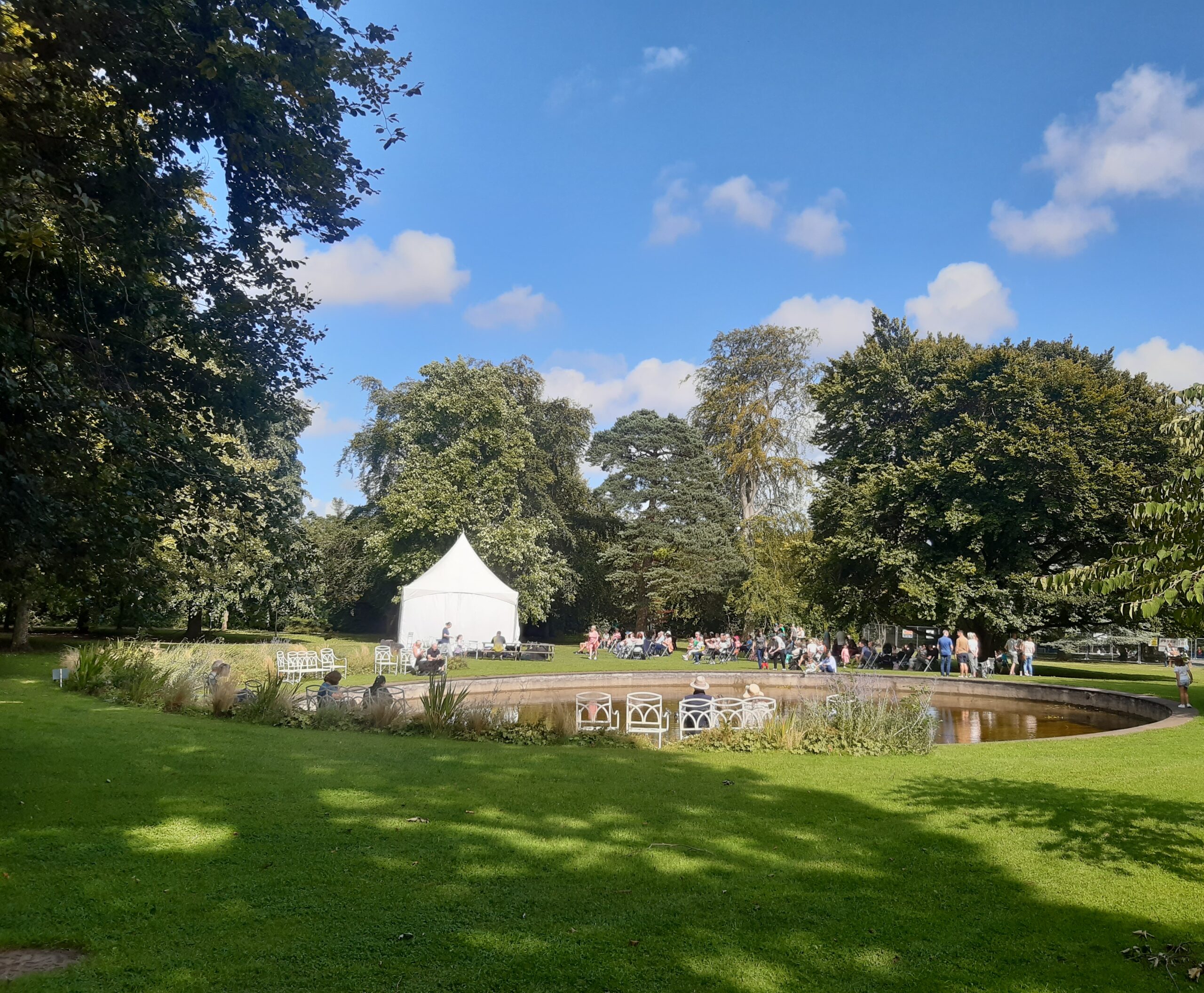 audience in front of white tent in Farmleigh Estate