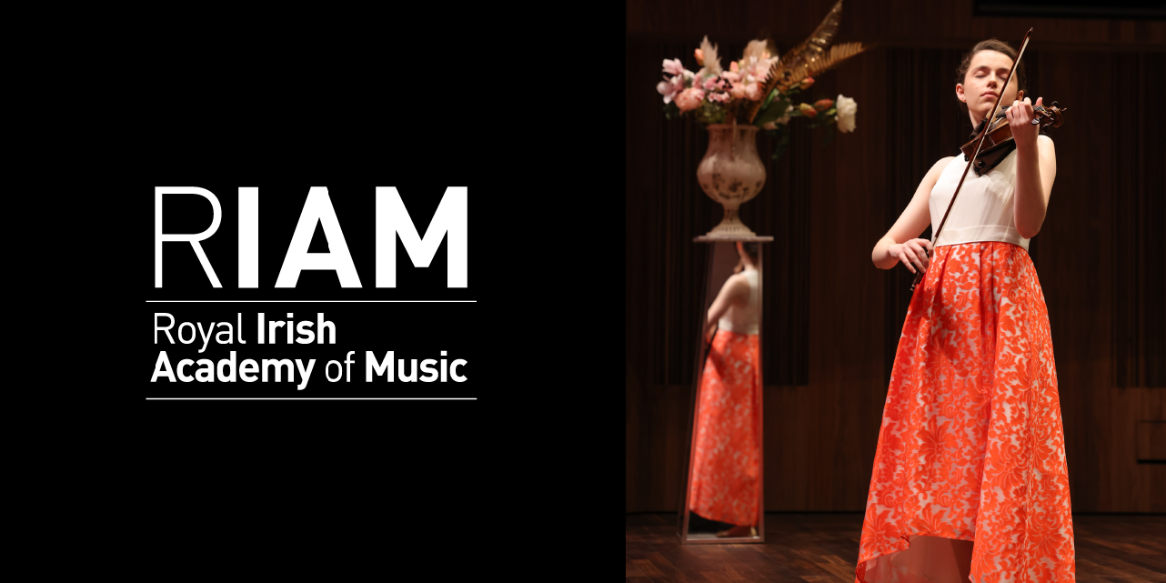 RIAM NOV25 violinist in dramatic red skirt, reflected in shining plinth, against black background